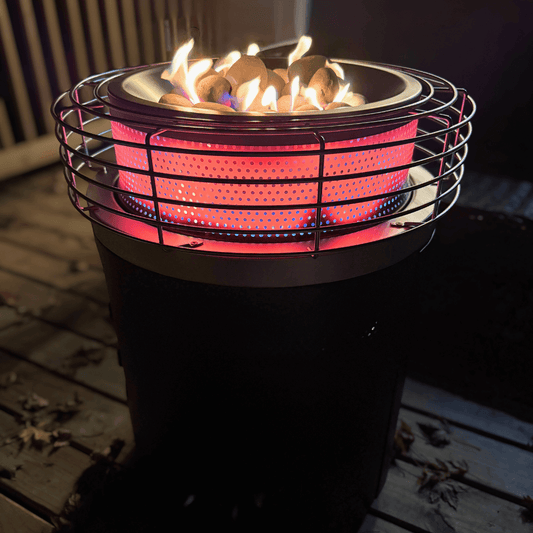Portable propane fire pit with flames on a wooden deck