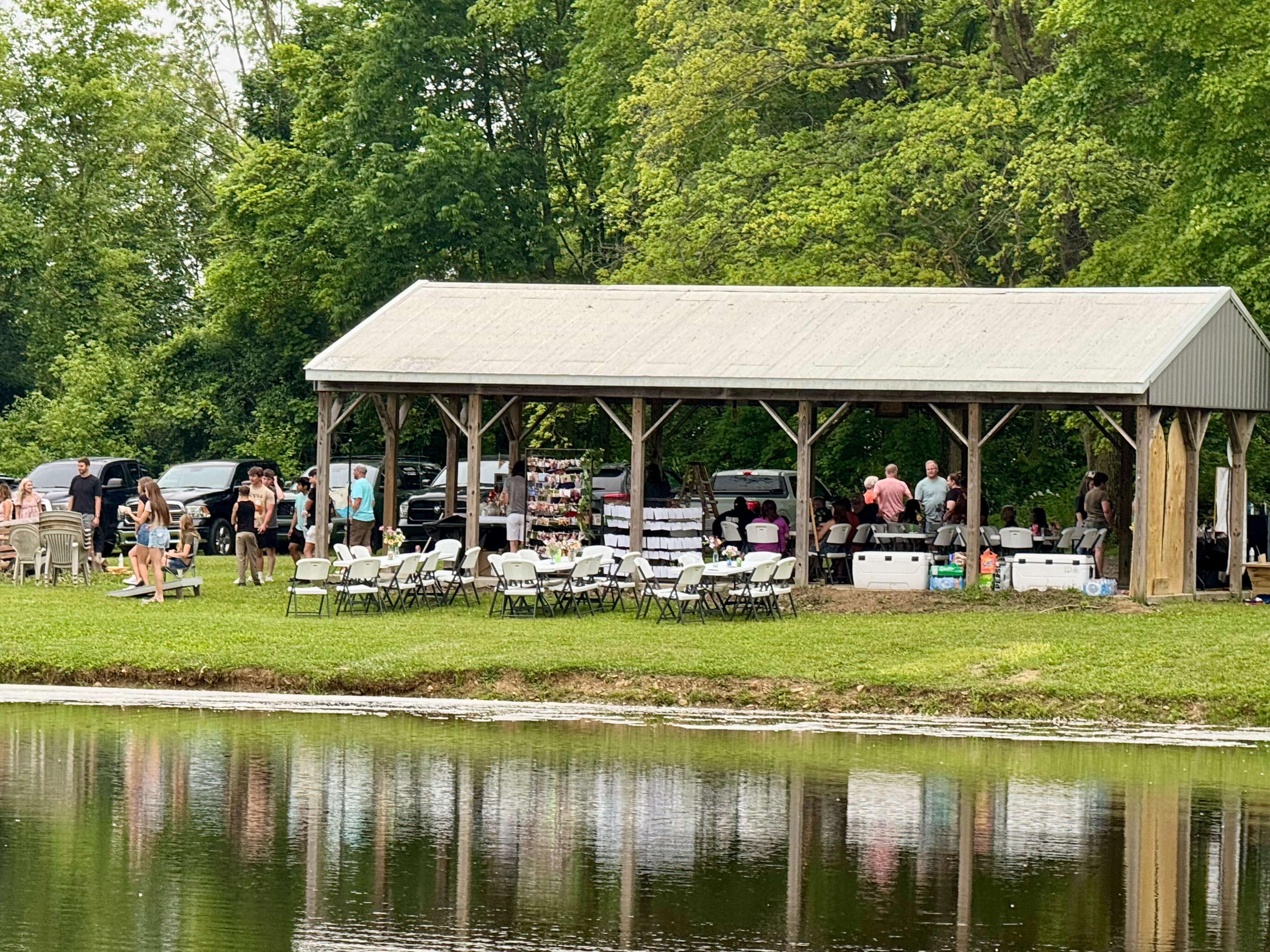 tables and chairs in lake setting